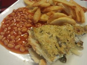 Vegan Quiche. Mushroom and Onion with Nutritional Yeast. Come with homemade chips and Heinz Beans or garden peas.  at Bookworm's Coffee in Ho Chi Minh City