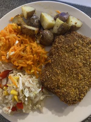 Cutlet, potatoes, two salads at Chwast Food in Warsaw