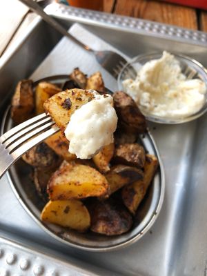 Roasted potatoes with the best garlic sauce. Honestly if you haven’t tried this garlic sauce you haven’t tried garlic sauce at all. at Chwast Food in Warsaw