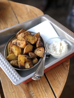 Roasted potatoes with the best garlic sauce. Honestly if you haven’t tried this garlic sauce you haven’t tried garlic sauce at all. at Chwast Food in Warsaw