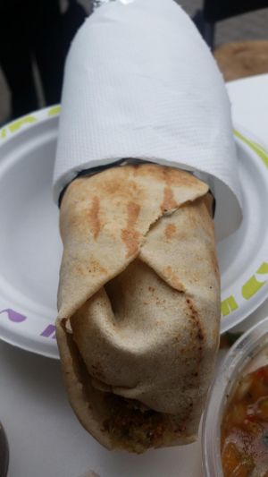 falafel sandwich with eggplant and pomagranate at Falafel Bejrut - Moliera in Warsaw