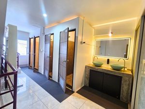 Deluxe Double Room with Balcony has shared bathroom that looks too chic at Ubuntu Live Boutique Hostel & Rooms in Phuket