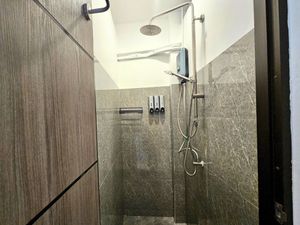 Superior Double Room with Balcony has two shower rooms with rainshower at Ubuntu Live Boutique Hostel & Rooms in Phuket