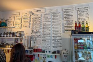 menu behind the counter at KIRAS - Totoriu 7 in Vilnius