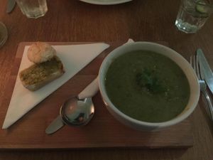 Vegan zucchini and lemon soup with bread side at Black Bear Cafe in Belfast