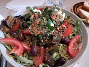 Salad with vegan lemon feta dip, aubergine, olives, beans and orzo pasta at Roots Kitchen in Turku