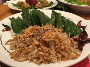 Pomelo Salad w/ crispy deep-fried garlic and crunchy bits, which you wrap in Betel Leaves - so refreshing and tasty! at Khun Churn - Eathai in Bangkok