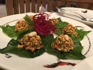 Lemongrass, herby and peanutty salad in Betel Leaves - tasty! at Khun Churn - Eathai in Bangkok