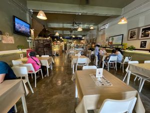 Tables and chairs at Loving Cafe in Kuala Lumpur