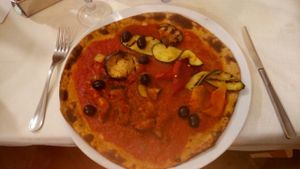 Pizza fruttariana con base impasto di Platano con metà caponata e metà verdure grigliate  at Il Papiro in Milan