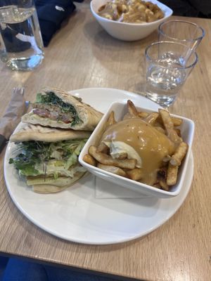 Tempeh wrap and small vegan poutine  at Pure Kitchen - Richmond Rd in Ottawa