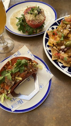 Entrantes: nachos, sandia con queso cabra (vgetarian) y salmon taco (pescatariano)  at Flax & Kale - Placa Castella in Barcelona