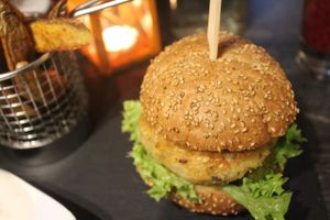 Vegan Fat Pumpkin Burger with potato wedges and vegan mayonnaise. at Green Pumpkin in Riga