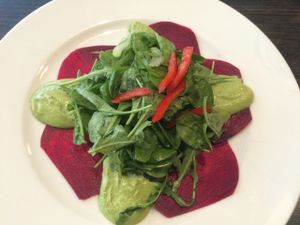 Raw beatroot carpaccio with raw cheese and nut cream at Green Pumpkin in Riga