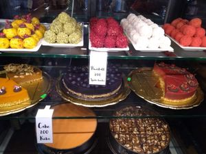 Fat Pumpkin dessert selection: cakes (I think some or all are raw, judging by the high price) and a stunning selection of much more affordable power balls. at Green Pumpkin in Riga