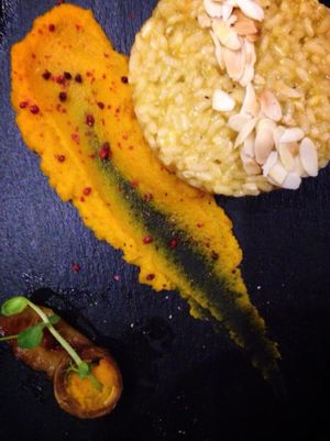 Nuts and citrus fruit risotto + carrot purée.  at Green Pumpkin in Riga