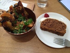 Plantain side dish and sweet potato cake with coconut frosting at Le Tricycle in Paris