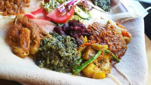 Half a plate of vegan friendly stuff on bread. To be eaten as is with your hands, using the bread to not get them too dirty, haha ?. Very nice! at Makamba in Stuttgart