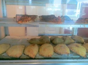 Pizza slices, vegetable pattie case. Ready to eat. at Soul Vegetarian in Tallahassee