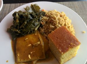 Lunch platter, collards, brown rice, cornbread, curried tofu. Well seasoned deliciousness. I usually like my curry & greens much spicier, yet this was good. at Soul Vegetarian in Tallahassee