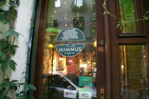 Looking through the window at Olive Tree Hummus Original in Budapest