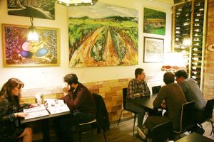 Cozy dinner in the art gallery at Olive Tree Hummus Original in Budapest