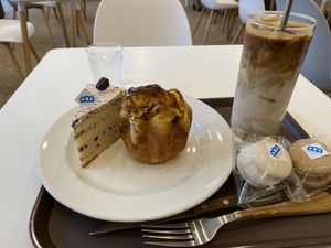 Cake, savory curry bread, latte, macaroons.   at The Bread Blue - Nogosan in Seoul
