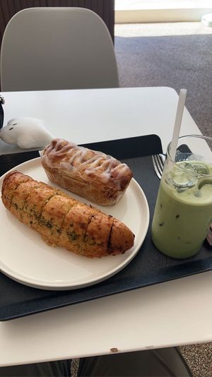 Garlic bread, cinnamon roll, and matcha latte  at The Bread Blue - Nogosan in Seoul