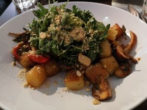 Potato Gnocchi with mushrooms, tomatoes, rucola, and cashew ";parmesan";  at Coca Sova in Dublin