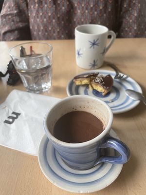 Hot chocolate on soy milk and cake with salted caramel   at Mamacoffee in Prague