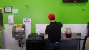 getting the juice at Dr. Jolly Sugarcane Juice in Rosemead