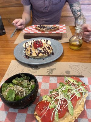 Almendra toast, vegan pancakes, hummus toast w side saladd  at La Cuisine in Cozumel