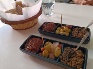 Complimentary eggplant/lentils/olives/pickles with bread at BAGUETTO MASSIRA in Marrakech