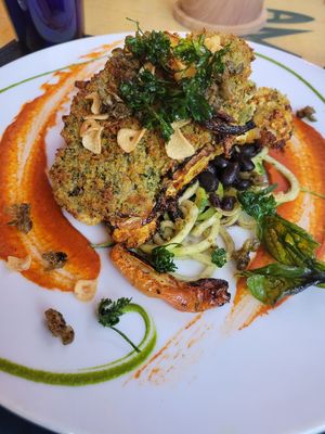 Cauliflower steak. Great flavor, little salty for me. at Yemanja Woodfired Grill in Oranjestad