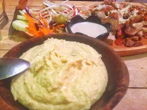 hummus with the vegan mushroom kebab in background  at Eat.Co in Koh Phangan