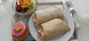 The wrap, a salad and dessert of the day (cupcake). at Les Delices De Gigi in Le Perreux