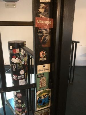 Animal rights stickers next to other, more traditional social justice stickers  at Belzepub in Prague