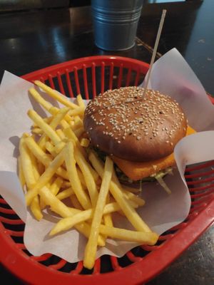 Fried cheese burger with fries at Belzepub in Prague