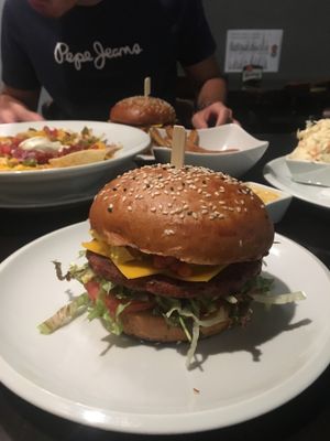 Vegan burger, nachos, fries, coleslaw  at Belzepub in Prague