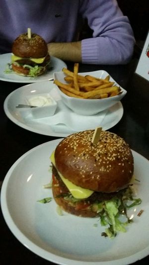Vegan Swiss burger with fries and soyanaise at Belzepub in Prague