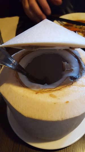 They will open the coconut for you so you can eat the meat at Indochine Vegan in San Francisco