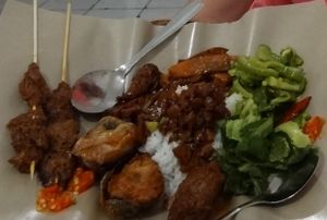 Some great mock meats, satay, greens, and Chinese 'pork'. at Vegetarian Restaurant in Jakarta