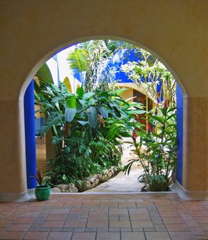 Front door view of the tropical garden central patio.  at Hotel MedioMundo in Merida