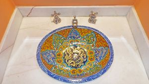 Marble counter and Talavera style sink at Hotel MedioMundo in Merida