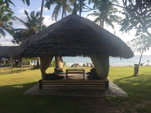 Chill in the comfy hut and enjoy the great veg food! at Coco Beach in 