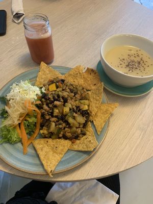 Menu del día - banana and mixed fruit smoothie, creamy white bean soup, fresh salad and protein (maybe soy) with black beans and veggies served with chips  at Veg Station in Medellin