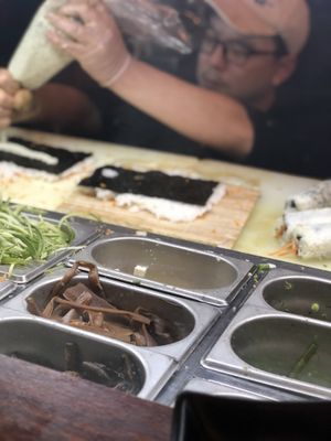 Take a seat at the bar and watch your sushi being made at Green Roll - Ahad Ha'Am St in Tel Aviv