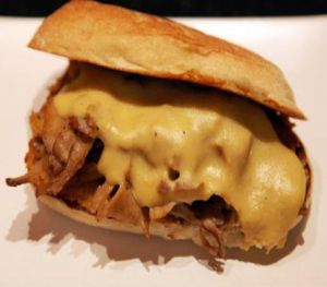 Philly cheesesteak: thinly-sliced seitan, peppers, mushrooms, and onions then smothered melted. at M Cafe in Los Angeles