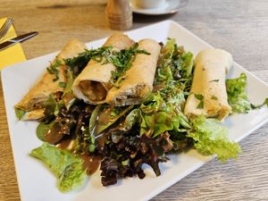 Indian pancakes with spicy yellow daal & cashews on salad (12.5€) - changing daily menu at Frucht and Genuss in Dusseldorf