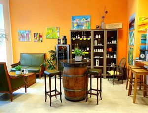 Fine foods shelves and seating at Frucht and Genuss in Dusseldorf